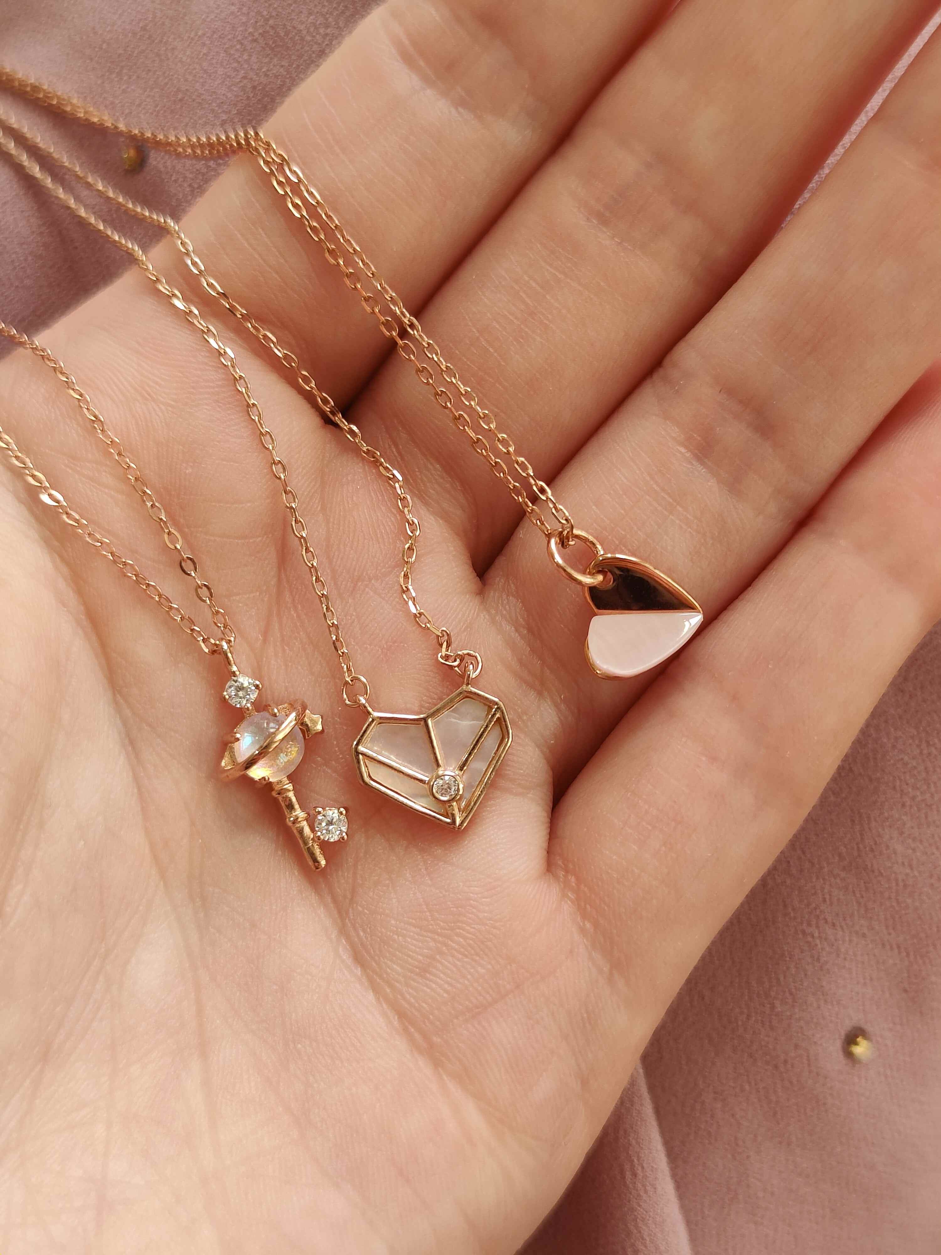 Hand with gold jewelry and bracelet